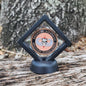 Decorative emblem on a wooden surface
