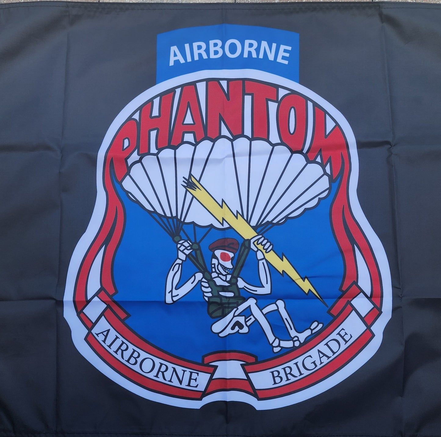 Airborne Phantom Brigade logo on a dark blue background