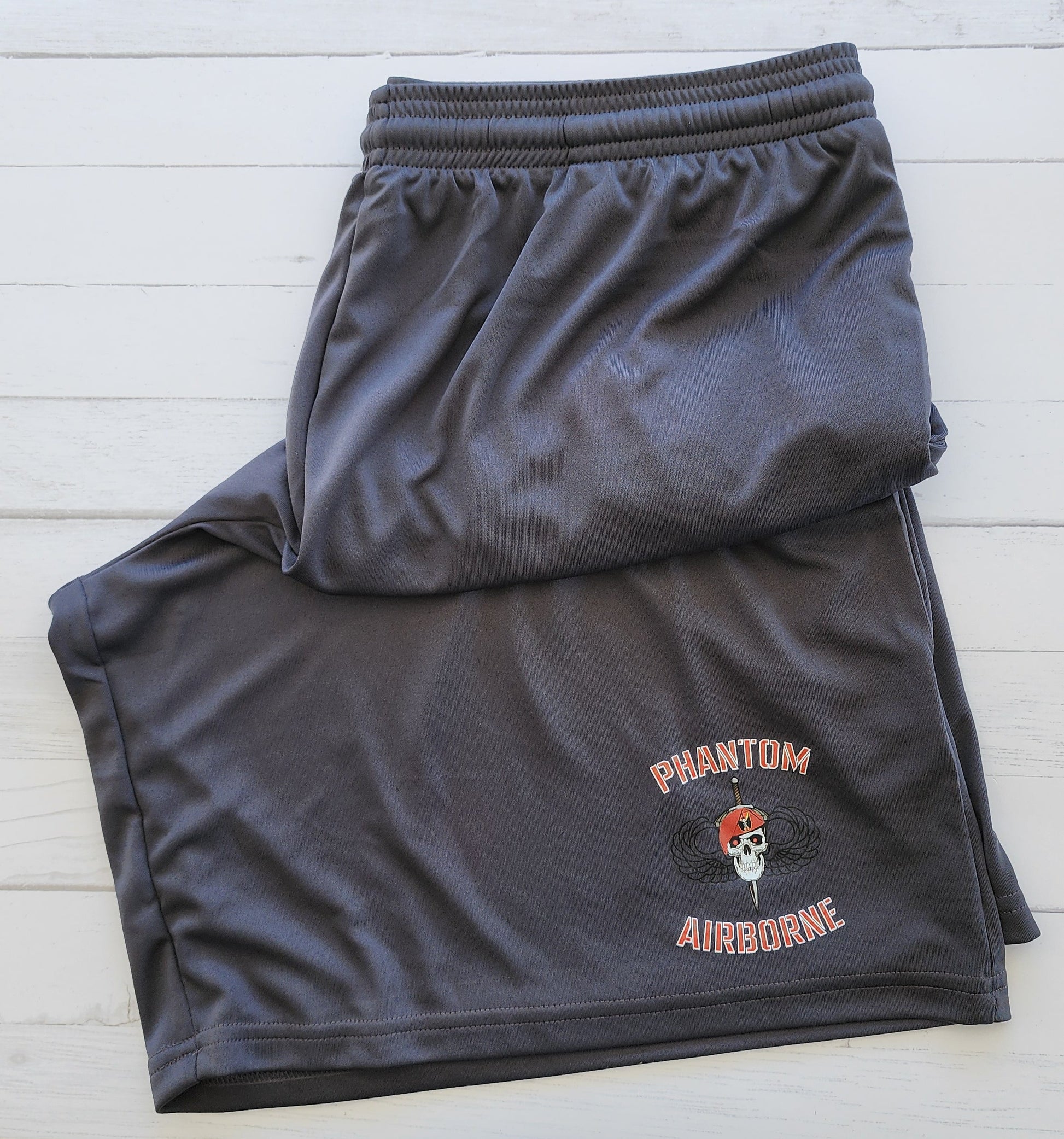 Black athletic shorts with a logo on 