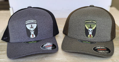Two gray and black caps with logos on a wooden surface