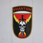 Patch with 'Phantom' text and skull design on a white background
