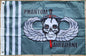 Flag with a skull design and 'Phantom Airborne' text on a brick wall background